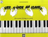 Vier Hände am Klavier