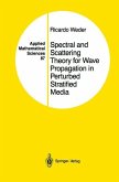 Spectral and Scattering Theory for Wave Propagation in Perturbed Stratified Media