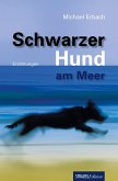 Schwarzer Hund am Meer