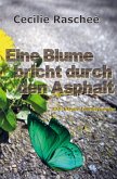 Eine Blume bricht durch den Asphalt