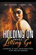 Holding On While Letting Go - Bild 1