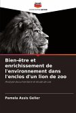 Bien-être et enrichissement de l'environnement dans l'enclos d'un lion de zoo Bien-être et enrichissement de l'environnement dans l'enclos d'un lion de zoo